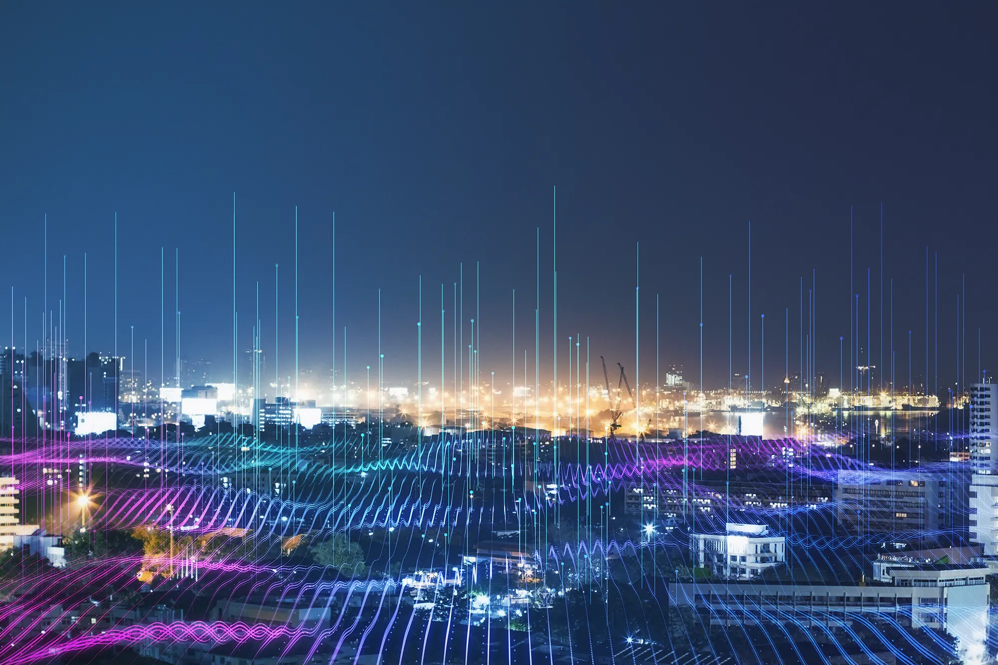 City at night with a digital network overlay
